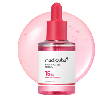 Medicube TxA Nacnamide 15 Serum in a clear dropper bottle with a pink cap and white label, set against a pink circular graphic on a white background, Medicube TXA Niacinamide 15% Glow Serum 30ml