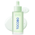A frosted glass dropper bottle of TOCOBO Cica Calming Serum, featuring a pale mint green cap and dropper. The bottle is centered against a white background with decorative translucent liquid droplets behind it. TOCOBO Cica Calming Serum 50ml