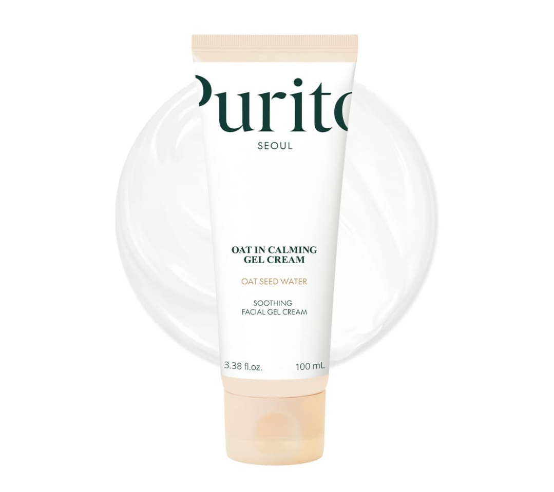 Purito Seoul Oat in Calming Gel Cream in a 100 mL squeeze tube, featuring a white body with dark green and gold text, a beige cap, and a soft circular translucent graphic behind it on a white background. Purito Seoul Oat In Calming Gel Cream 100ml