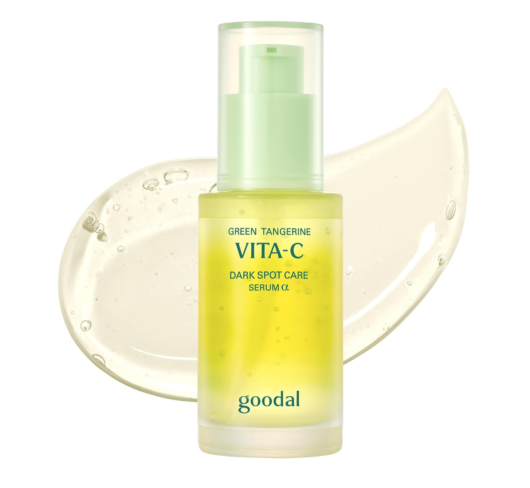 A bottle of Goodal Vita-C Green Tangerine Dark Spot Care Serum G, featuring a frosted glass bottle with a pale green pump, set against a white background with a translucent yellow-green gel smear behind it. Goodal Green Tangerine Vita-C Dark Spot Care Serum Alpha 40ml