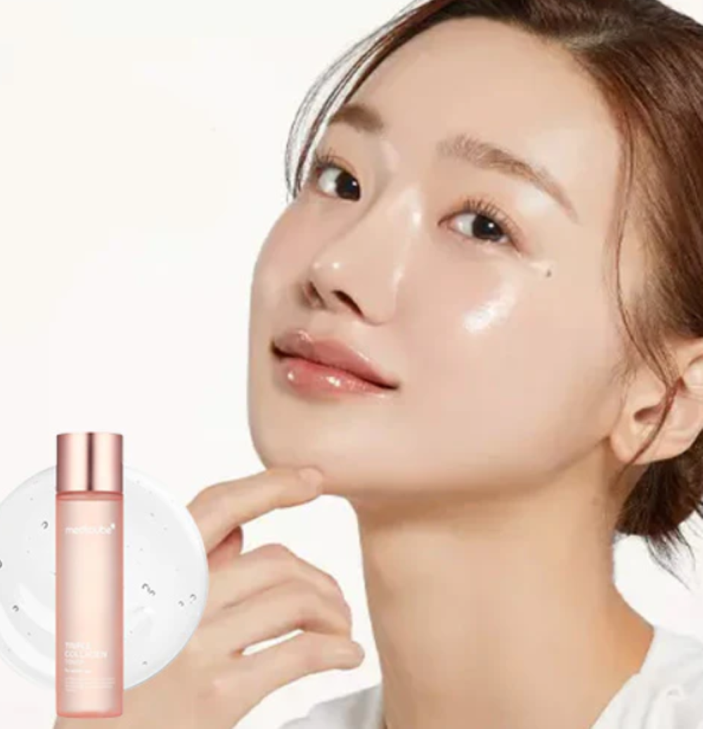 Woman applying a skincare product with a bottle in the foreground on a white background, Medicube Triple Collagen Toner 140ml