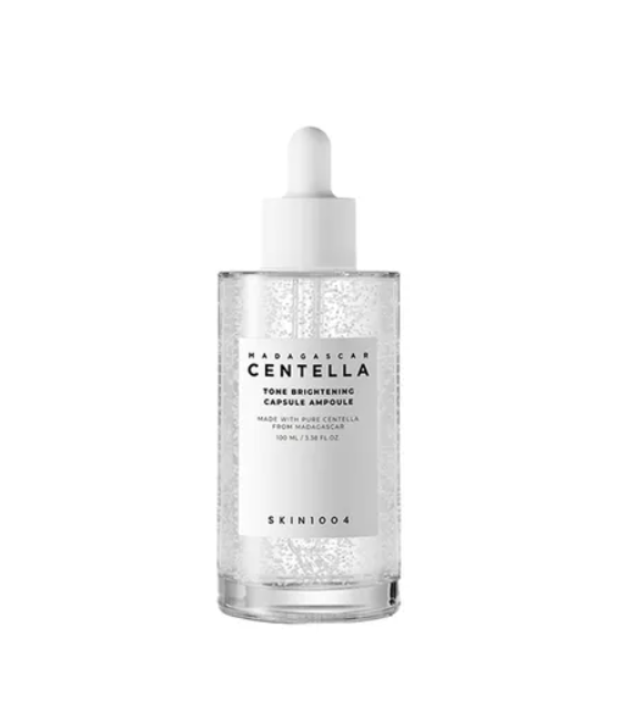 Skincare serum bottle with dropper labeled 'Madagascar Centella' on a white background, Skin1004 Madagascar Centella Tone Brightening Capsule Ampoule 100ml