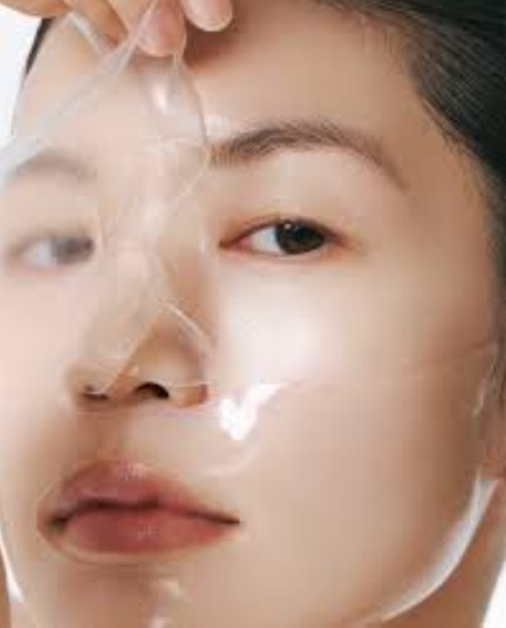 Close-up of a person applying a facial mask with a focus on the skin texture, Abib Glow Collagen Mask Glutathione Film 4pcs