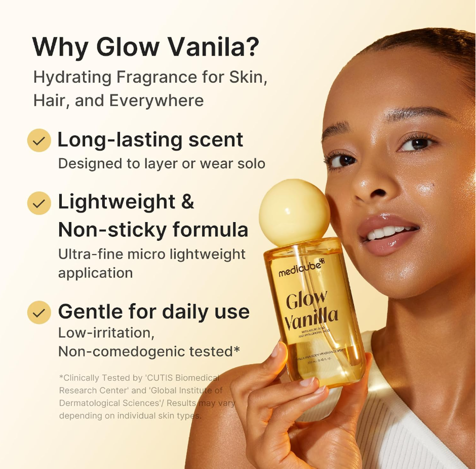 A woman holds a bottle of mediaboxed Glow Vanilla body oil against a warm beige background with promotional text on the left. The bottle is transparent with golden-yellow liquid and a round pale yellow cap. Medicube Glow Vanilla Hair Body Fragrance Mist 100ml