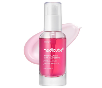 A clear cosmetic pump bottle filled with bright pink serum, labeled medicube PDRN COLLAGEN GLOW JELLY SERUM, shown on a white background with a soft pink smear behind it. Medicube PDRN Collagen Glow Jelly Serum 30ml