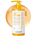 A bottle of medicube Kojic Acid Turmeric Body Peel Shot with a yellow pump dispenser, set against a white background with a large orange circular graphic behind it. Medicube Kojic Acid Turmeric Body Peel Shot 280ml