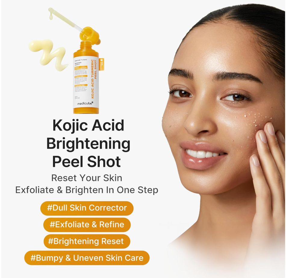Promotional graphic for Kojic Acid Brightening Peel Shot showing an orange bottle with a dropper, a cream smear, and a woman with clear, bright skin touching her cheek. Text highlights exfoliation and brightening benefits, with orange hashtag labels at the bottom. Medicube Kojic Acid Turmeric Body Peel Shot 280ml