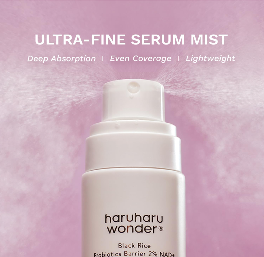 A white Haruharu Wonder Ultra-Fine Serum Mist bottle centered against a soft pink background with mist spraying from the nozzle. Text at the top reads 'ULTRA-FINE SERUM MIST' with additional product benefits listed below. Haruharu Wonder Black Rice Probiotics Barrier 2% NAD+ Serum Mist 80ml
