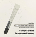 A tube of Heveblue Black Yuja Bean Auto Eye Cream is shown diagonally against a light cream background with water droplets. The tube is white with black text and a black cap, accompanied by promotional text on the right. Heveblue Black Yuja Bean Lifting Auto Eye Cream 15ml