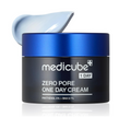 A black cosmetic jar of medicube Zero Pore One Day Cream with a metallic blue lid, shown with a dollop of pale blue cream on top, on a white background with a subtle reflection. Medicube Zero Pore One Day Cream 50ml