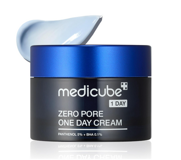 A black cosmetic jar of medicube Zero Pore One Day Cream with a metallic blue lid, shown with a dollop of pale blue cream on top, on a white background with a subtle reflection. Medicube Zero Pore One Day Cream 50ml