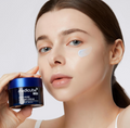 Woman holding a jar of Medicube cream with a white background, Medicube Zero Pore One Day Cream 50ml