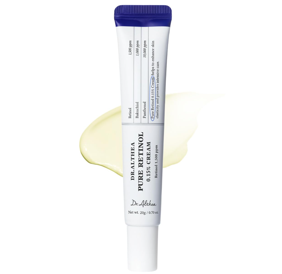 A tube of Dr. Althia Pure Puff Cream 0.15% against a white background with a pale yellow cream smear behind it. Dr. Althea Pure Retinol 0.15% Cream 20g