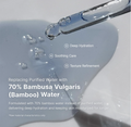 A close-up of a clear glass dropper releasing a transparent liquid onto a white surface, with marketing text stating it is 70% Bambusa vulgaris (bamboo) water and listing benefits like deep hydration, soothing care, and texture refinement. Dr. Althea Aqua Marine Deep Serum 30ml
