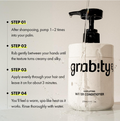 A bottle of grab!ty hairlifting water conditioner with a black pump, shown with instructional text on how to use it. The bottle is white with black lettering and is set against a light background with water dripping from the pump and around the base. Grabity Hair Lifting Water Conditioner 270ml