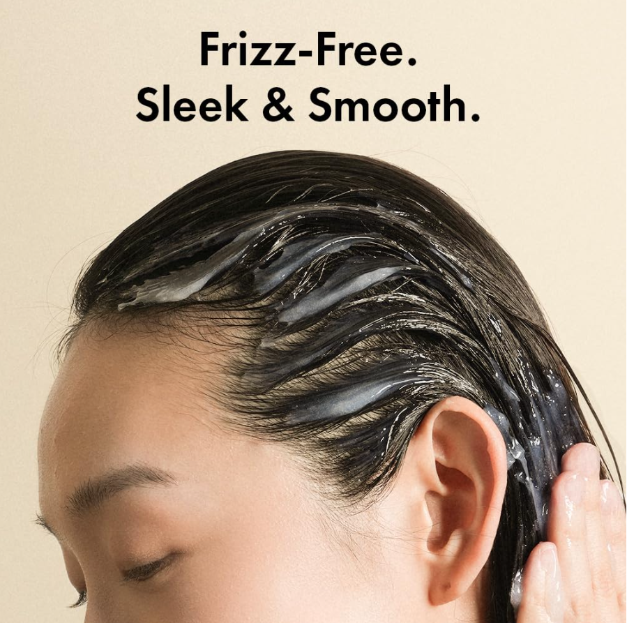 Person applying hair product with text 'Frizz-Free. Sleek & Smooth.' on a beige background, Grabity Hair Lifting Water Conditioner 270ml