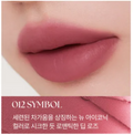 Close-up of lips with a pink lipstick labeled '012 Symbol' on a white background, Muzigae Mansion Objet Liquid 012 Symbol