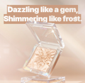 Makeup compact with text 'Dazzling like a gem, Shimmering like frost.' on a beige background, Clio Peism Highlighter 2 Fairy Pink 8g