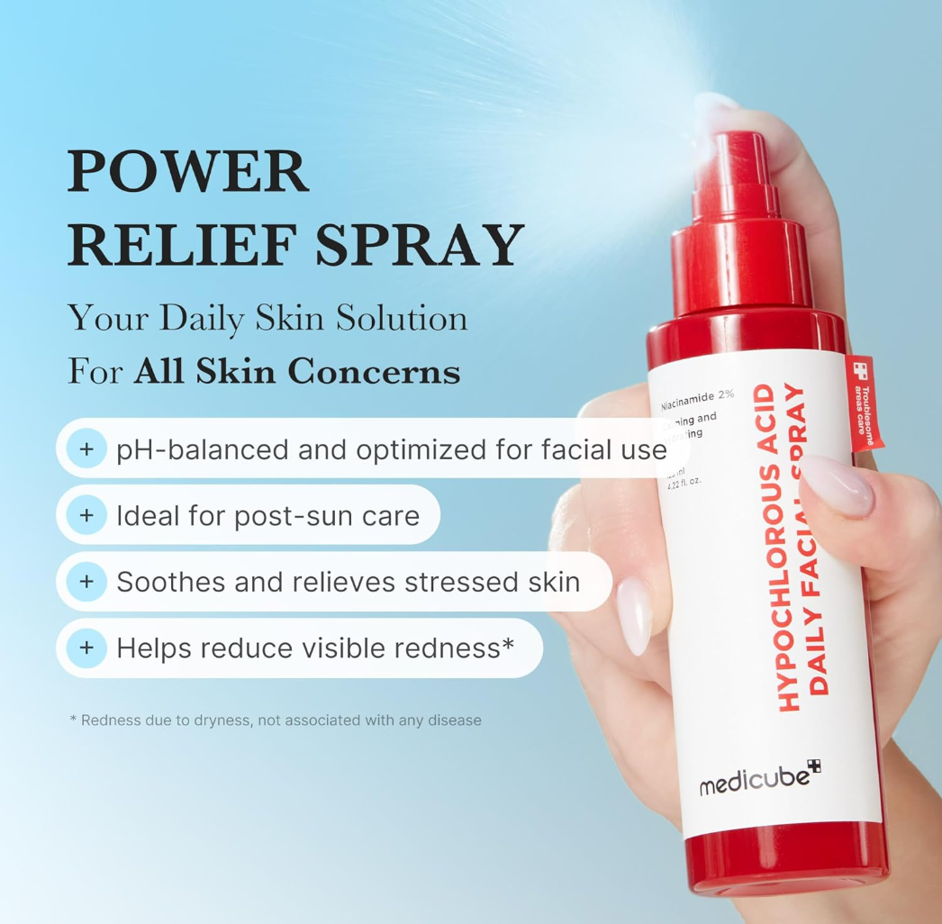 Hand holding a red and white spray bottle labeled 'Power Relief Spray' with text about its benefits on a blue background, Medicube Hypochlorous Acid Daily Facial Spray 125ml