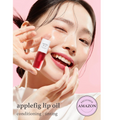 Woman holding a bottle of applefig lip oil against a pink background with 'Exclusive Amazon' label, Nooni Applefig Lip Oil 3.7ml
