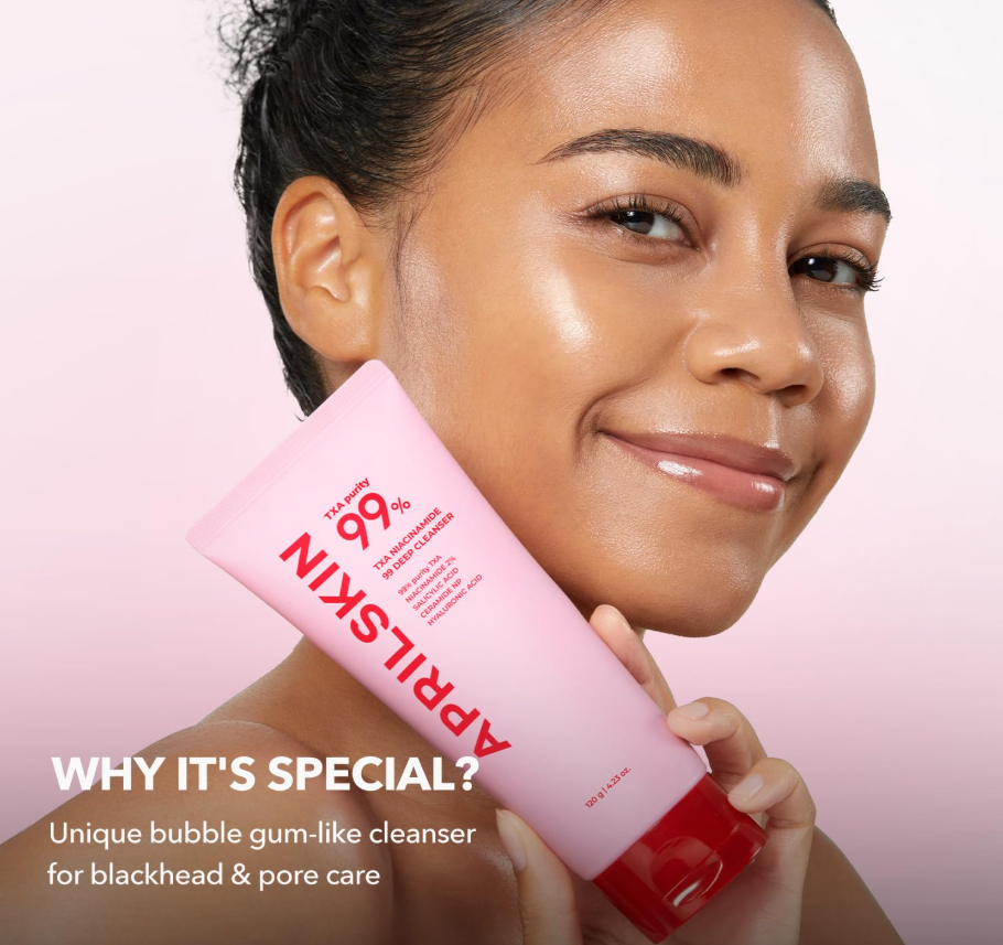 Woman holding a pink skincare product with text about its special qualities on a light pink background, April Skin TXA Niacinamide 99 Deep Cleanser 120g