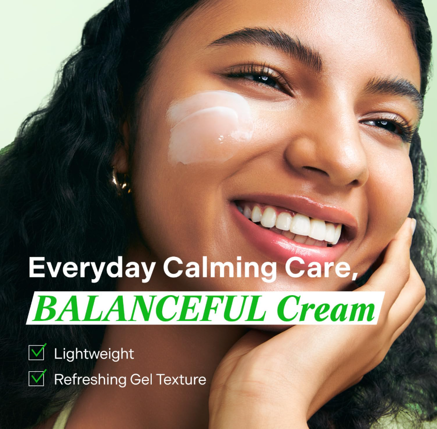 Woman applying Balanceful Cream to her face with a green background