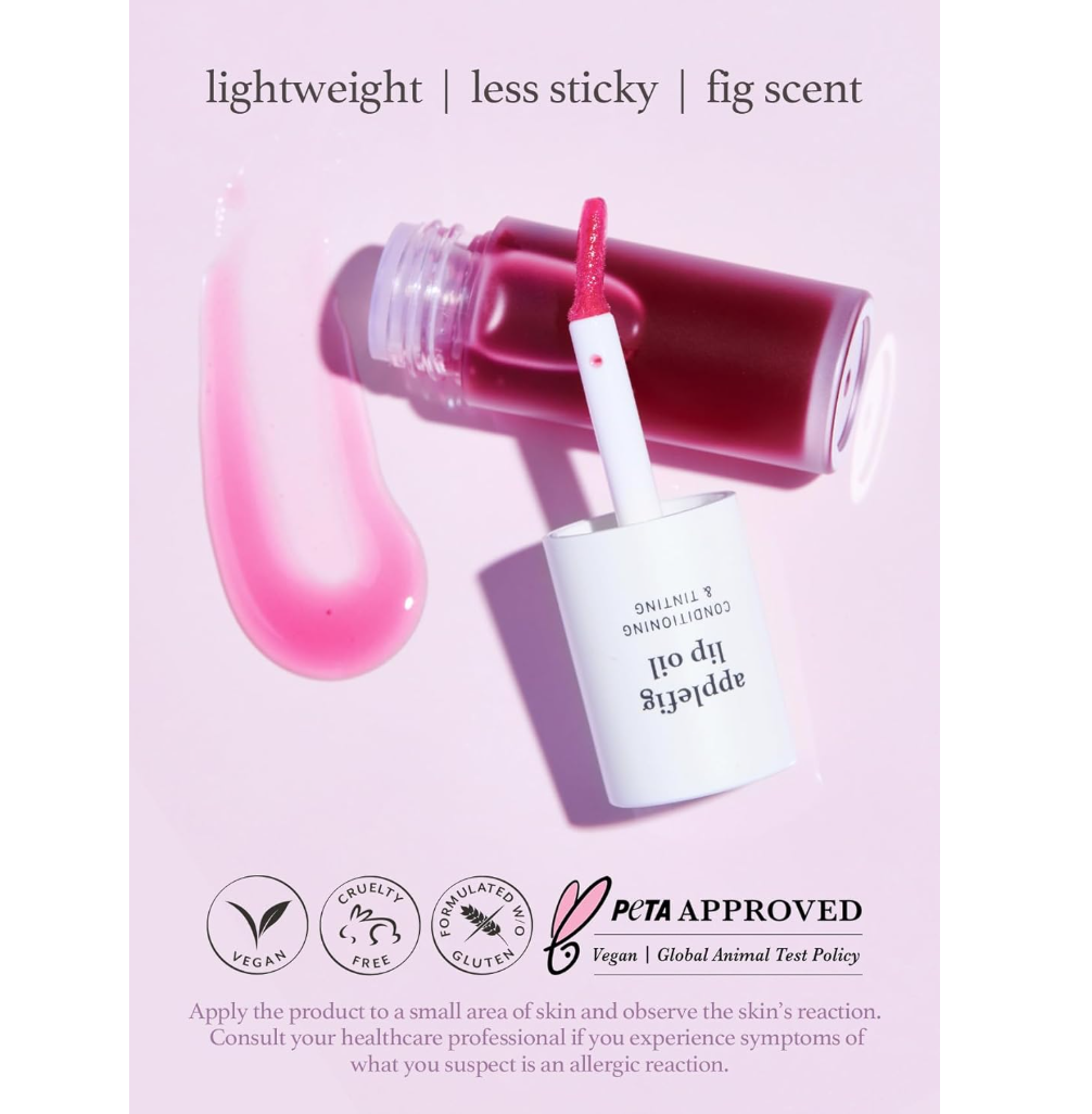 Cosmetic product with applicator on a pink background, featuring PETA approval logo, Nooni Applefig Lip Oil 3.7ml