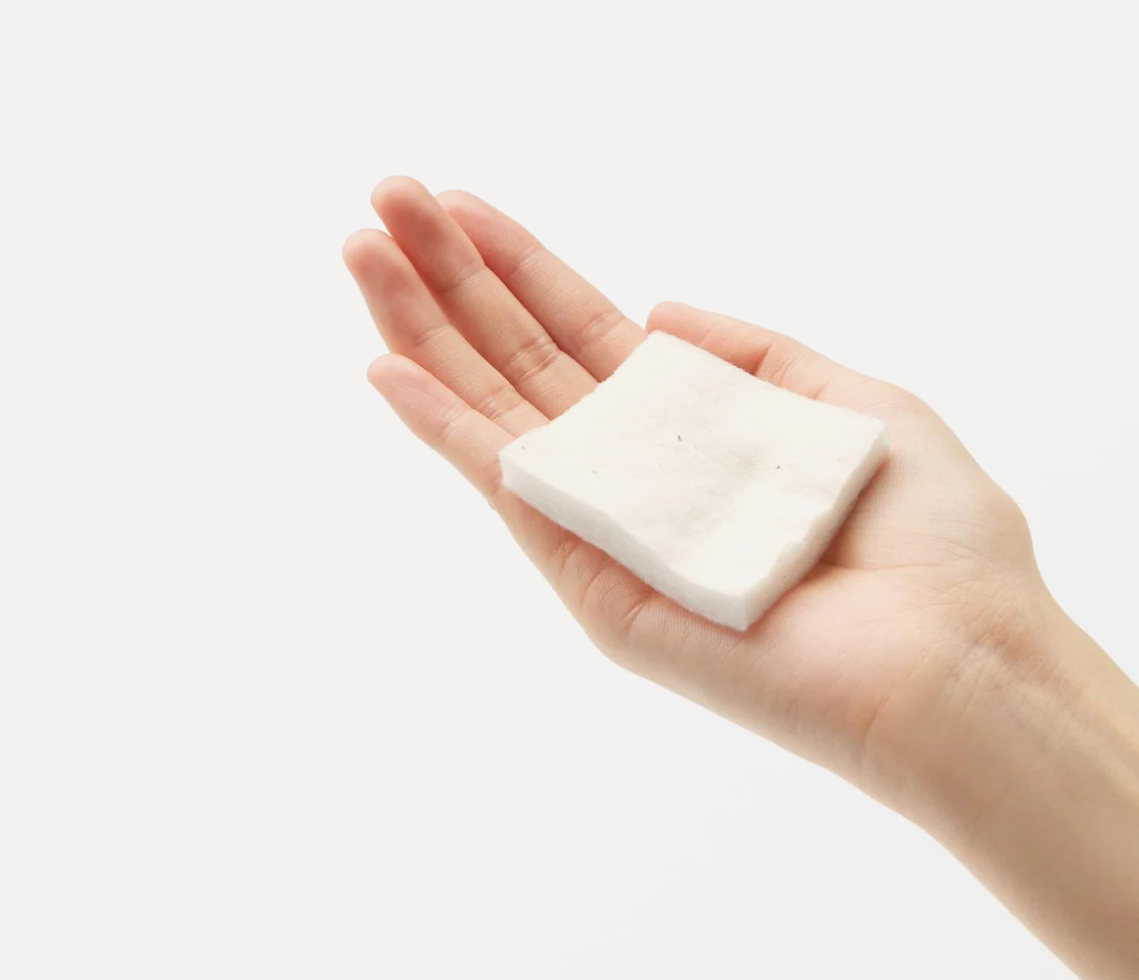 Hand holding a bar of soap against a white background, MUJI Unbleached Cotton 180pcs 60mmx50mm