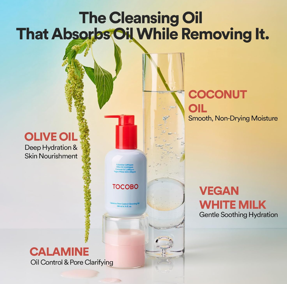 Tocobo cleansing oil bottle with a red pump and a clear jar of pink oil, shown beside a tall glass of clear liquid and a green herb sprig, with text describing coconut oil, olive oil, vegan white milk, and calamine. TOCOBO Calamine Pore Control Cleansing Oil 200ml