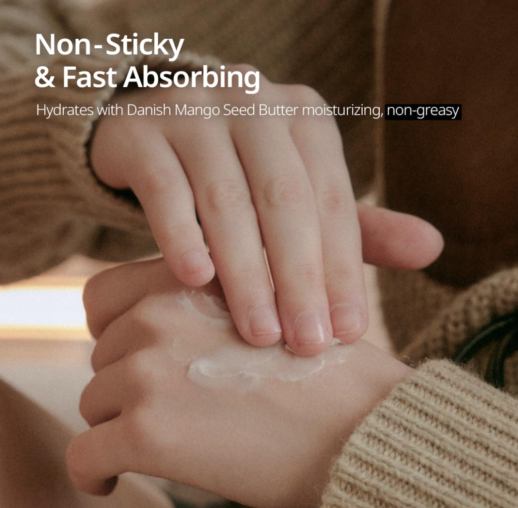 Hand applying a moisturizing cream with text highlighting 'Non-Sticky & Fast Absorbing' and 'Hydrates with Danish Mango Seed Butter', Hetras Hand Cream Mango Seed Butter Hotel Wood 50ml