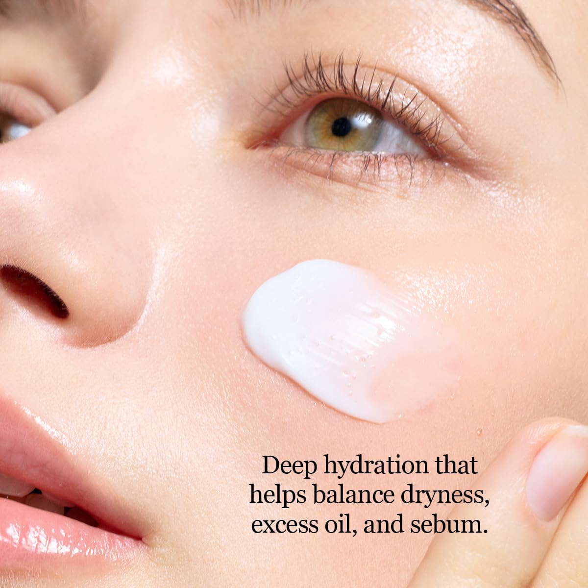 Close-up of a person applying cream to their face with text about deep hydration, Round lab Birch Juice Moisturizing Cream 80ml