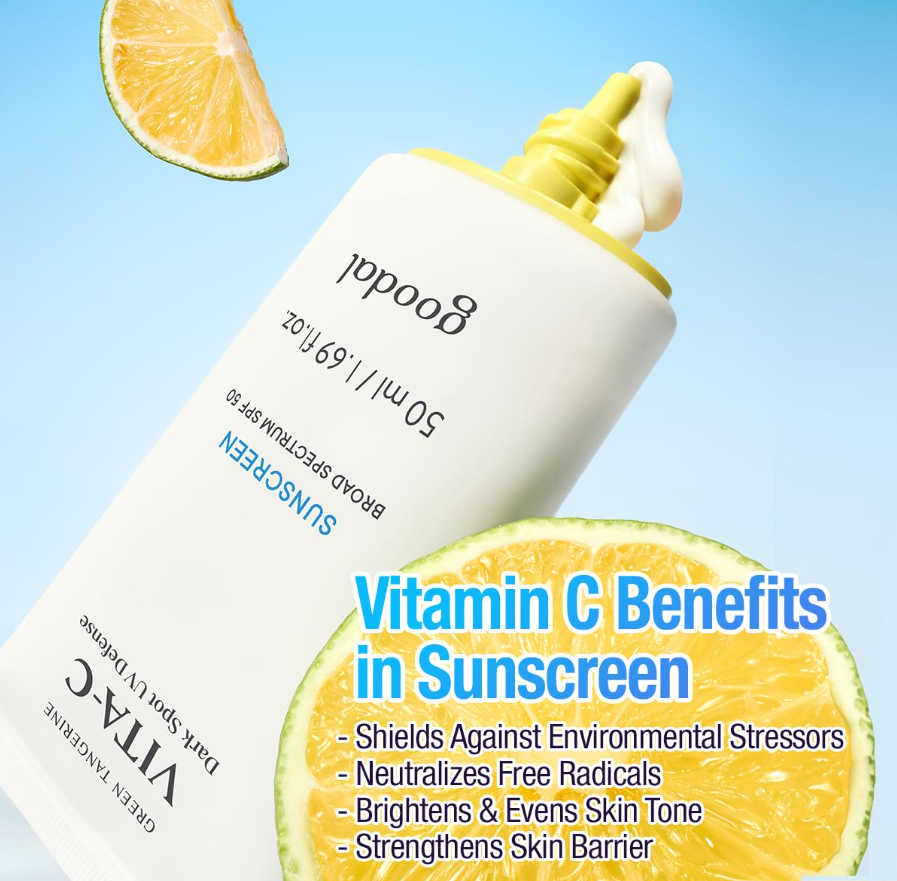 Sunscreen bottle with lemon slices on a blue background, highlighting vitamin C benefits, Goodal Green Tangerine Vita C Dark Spot UV Defense Sunscreen Spf 50 50ml