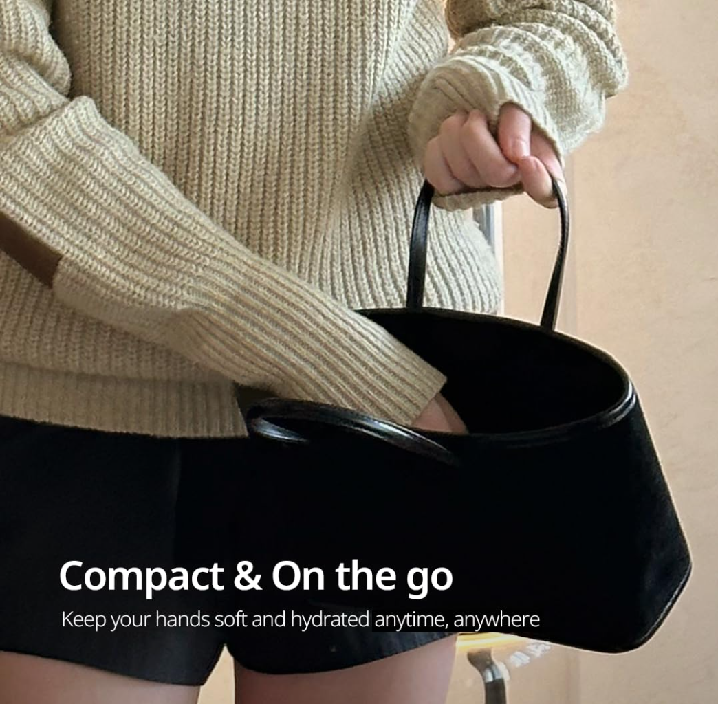 Person holding a black handbag with text about hand care, Hetras Hand Cream Mango Seed Butter Hotel Wood 50ml