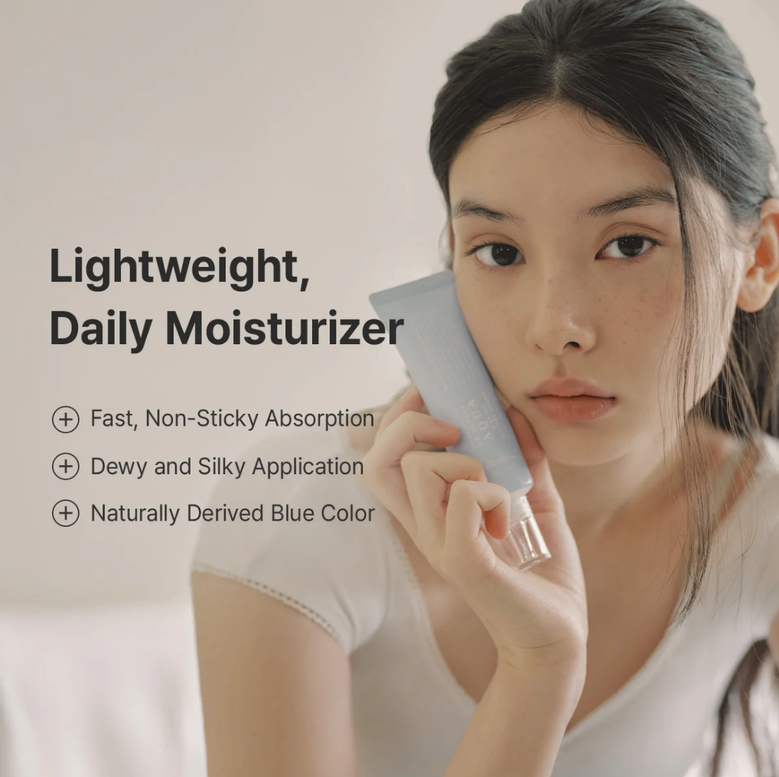 Woman holding a skincare product with text about a lightweight daily moisturizer, Dr.althea Aqua Marine Watery Cream 50ml