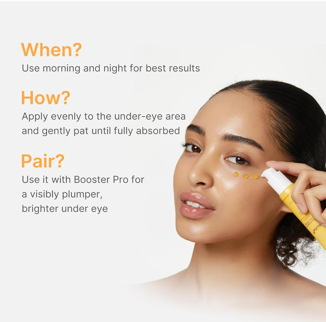A woman applies a yellow and white cosmetic dropper product to her under-eye area, with text on the left explaining usage: 'When? Use morning and night for best results', 'How? Apply evenly to the under-eye area and gently pat until fully absorbed', and 'Pair? Use it with Booster Pro for a visibly plumper, brighter under eye', MEDICUBE Kojic Acid Turmeric Vita Eye Gel Serum 30ml