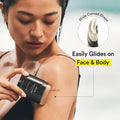 Woman using a hair removal device on her arm with text highlighting its wide curved shape and ease of use.