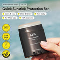 Abib Quick Sunstick Protection Bar with product details on a blurred natural background