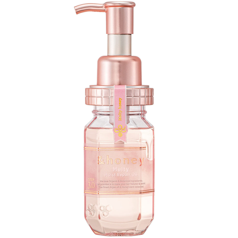 Clear bottle with pink liquid and rose gold pump on a white background, &Honey Melty Moist Repair Oil 100ml